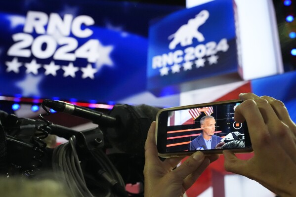 Corey Lewandowski is seen on the screen of a cellphone during a walkthrough at the 2024 Republican National Convention, Sunday, July 14, 2024, in Milwaukee. (AP Photo/Nam Y. Huh)
