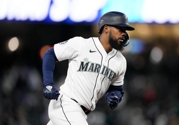 Seattle Mariners left fielder AJ Pollock (8) runs out his two-run