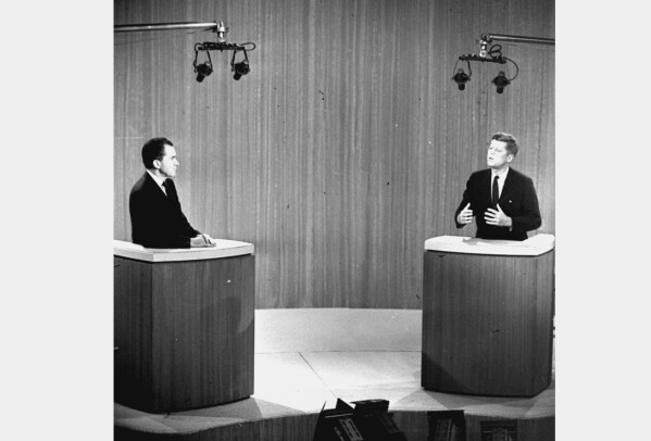 FILE - Sen. John F. Kennedy, right, speaks as Vice President Richard M. Nixon listens during the first ever televised presidential debate on Oct. 21, 1960, in New York. Presidential debates didn't become a recurring event until 1976 when the League of Women Voters began sponsoring them. There are real questions about whether any of the presidential candidates will confront each other on a debate stage in 2024. (AP Photo, File)