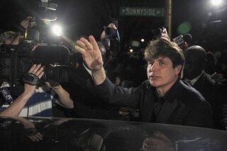 
              FILE - In this March 15, 2012 file photo, former Illinois Gov. Rod Blagojevich departs his Chicago home for Littleton, Colo., to begin his 14-year prison sentence on corruption charges. Imprisoned ex-governor, Blagojevich, filed paperwork Tuesday, June 5, 2018, asking President Donald Trump to commute his 14-year prison term for corruption that included seeking to sell an appointment to the Senate seat Barack Obama vacated to become president. (AP Photo/Charles Rex Arbogast, File)
            