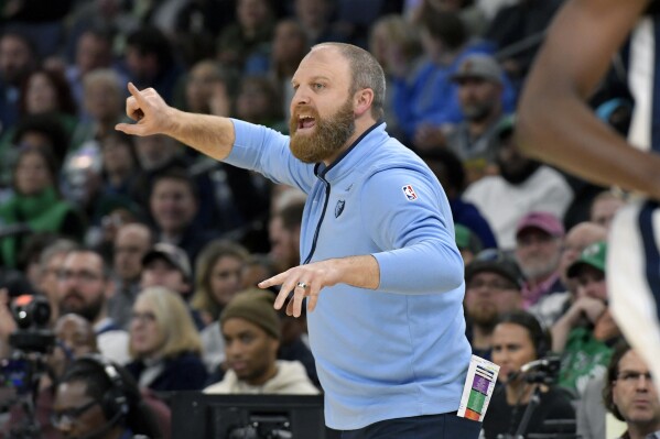 Memphis Grizzlies head coach Taylor Jenkins calls to players in the first half of an NBA basketball game against the Boston Celtics, Sunday, Nov. 19, 2023, in Memphis, Tenn. (AP Photo/Brandon Dill)
