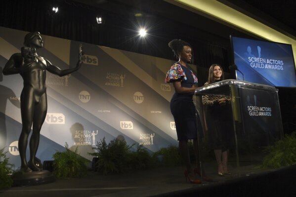 Danai Gurira, left, and America Ferrera announce nominations for the 26th annual Screen Actors Guild Awards at the Pacific Design Center on Wednesday, Dec. 11, 2019, in West Hollywood, Calif. The show will be held on Sunday, Jan. 19, 2020, in Los Angeles. (AP Photo/Chris Pizzello)