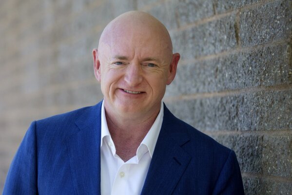 Democratic challenger Mark Kelly, for the U.S. Senate race against Republican incumbent Martha McSally, poses for a photo outside of the Udall Park Main Recreation Center, Tuesday, Sept. 29, 2020. (Mamta Popat/Arizona Daily Star via AP)