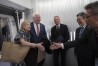 U.S. Ambassador to Japan George Glass, second left, and his wife Mary, left, are welcomed by Joseph Young, center, Acting Deputy Chief of Mission at the US Embassy in Tokyo, Eiichi Kawahara, second right, Ambassador Special Assistant to the Minister for Foreign Affairs, and Victor Osumi, right, President of Japan Operations of Delta, upon their arrival at Haneda Airport in Tokyo Friday, April 18, 2025. (Kazuhiro Nogi/Pool Photo via AP)