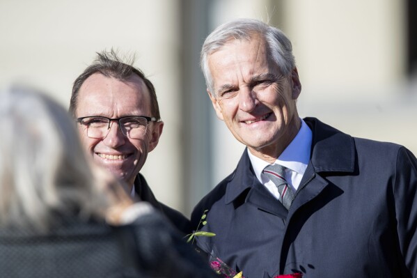 Newly appointed Norway's Foreign Minister Espen Barth Eide, left, and Norway's Prime Minister Jonas Gahr Store pose out of the Palace after an extraordinary cabinet meeting in connection with changes in the government, in Oslo, Norway, Monday, Oct. 16, 2023. (Emilie Holtet/NTB Scanpix via AP)