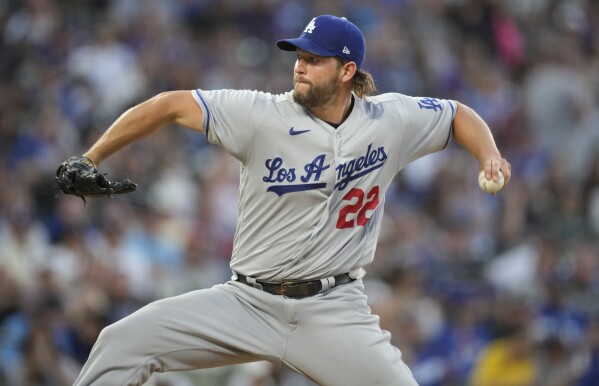 Los Angeles Dodgers starting pitcher Clayton Kershaw works against the Colorado Rockies in the sixth inning of a baseball game Tuesday, June 27, 2023, in Denver. (AP Photo/David Zalubowski)
