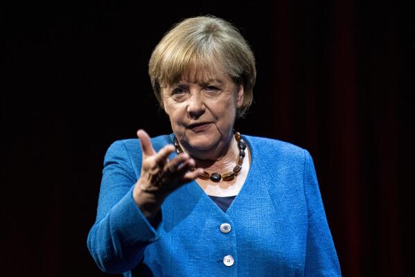 Former German Chancellor Angela Merkel answers questions from journalist and author Alexander Osang under the theme "So what is my country?" at the Berliner Ensemble in Berlin, Germany, Tuesday, June 7, 2022. (Fabian Sommer/dpa via AP)