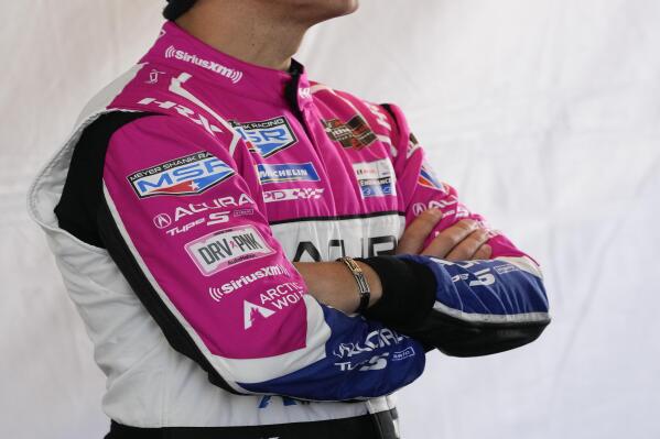 Helio Castroneves waits in his pit stall during a practice session for the Rolex 24 hour auto race at Daytona International Speedway, Thursday, Jan. 26, 2023, in Daytona Beach, Fla. (AP Photo/John Raoux)