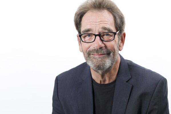 FILE - Musician Huey Lewis poses for a portrait in New York on Oct. 2, 2019. Lewis, who with his band The News stormed radio in the 1980s with such rock-pop hits as “The Power of Love” and “I Want a New Drug,” is about to take his music to a Broadway stage with “The Heart of Rock & Roll," starting March 2024. (Photo by Brian Ach/Invision/AP, File)
