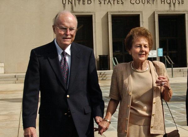 FILE - In this Sept. 2, 2003 file photo, from left, Jack and Jo Ann Hinckley, parents of John Hinckley, leave the U.S. Courthouse in Washington after a hearing regarding John Hinckley's visitation privileges.   Jo Ann Hinckley, whose son John  attempted to assassinate President Ronald Reagan in 1981 and who spent her final years living with her son in Virginia, has died.   Barry Levine, John Hinckley’s longtime attorney, confirmed Hinckley's death to The Associated Press on Tuesday, Aug. 3, 2021.   (AP Photo/Gerald Herbert, File)