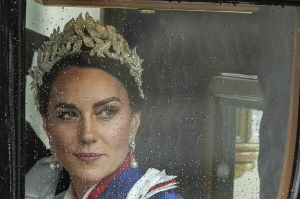 FILE - Kate, Princess of Wales, departs Westminster Abbey after the coronation ceremony in London, May 6, 2023. The scandal over Kate, Princess of Wales’ family snapshot — dubbed “photogate” — is a new chapter in the thorny relationship between the media and Britain’s royal family. (AP Photo/Alessandra Tarantino, File)