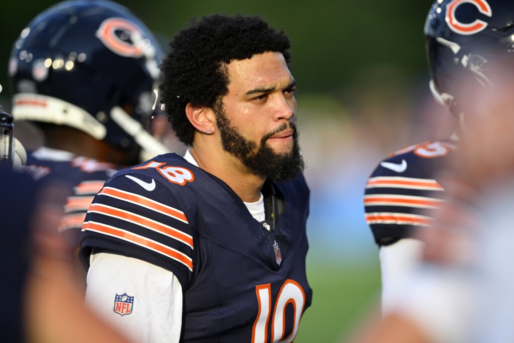 Chicago Bears quarterback Caleb Williams (18) stands on the sideline before an NFL exhibition Hall of Fame football game against the Houston Texans, Thursday, Aug. 1, 2024, in Canton, Ohio. (AP Photo/David Richard)