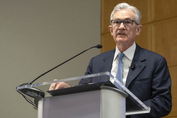 Federal Reserve Chairman Jerome Powell speaks before climate protestors interrupted his speech at the 24th Jacques Polak Research Conference at the International Monetary Fund on Thursday, Nov. 9, 2023 in Washington. (AP Photo/Mark Schiefelbein)