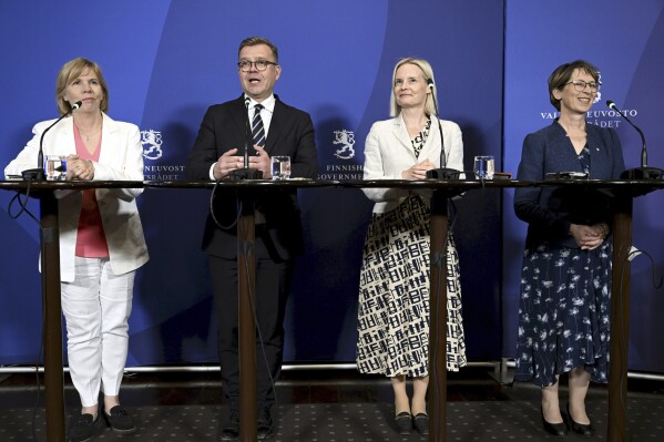 From left, Swedish People's Party chair Anna-Maja Henriksson, National Coalition Party chair Petteri Orpo, The Finns Party chair Riikka Purra and Christian Democrats chair Sari Essayah announce that the government programme is ready in Helsinki, Finland, Thursday, June 15, 2023. The head of Finland’s conservative National Coalition Party, which came first in the April 2 elections, will present Friday, June 16, 2023, a government program for a center-right coalition that includes a far-right anti-immigration party with “saving measures.” NCP leader Petteri Orpo, who is expected to become the Nordic nation’s next prime minister, said four parties had agreed to form a government. (Heikki Saukkomaa/Lehtikuva via AP)