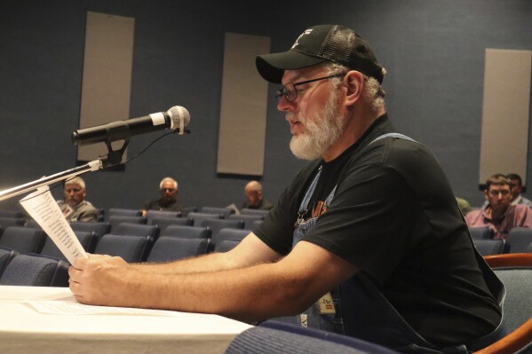 John Robinson, a retired coal miner with black lung, speaks during a public hearing hosted by the federal Mine Safety and Health Administration about its draft rule to limit worker exposure to silica dust, Aug. 10, 2023, at the agency’s office in Beaver, W.Va. (AP Photo/Leah Willingham)