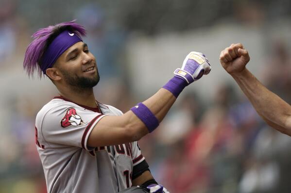 Arizona Diamondbacks' Lourdes Gurriel Jr. is congratulated after hitting a solo home run during the eighth inning of a baseball game against the Texas Rangers in Arlington, Texas, Wednesday, May 3, 2023. (AP Photo/LM Otero)