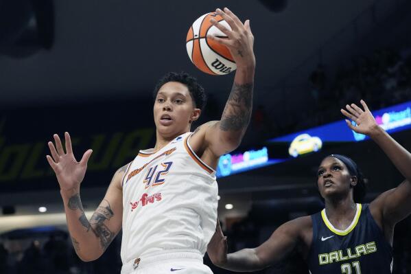Phoenix Mercury center Brittney Griner (42) grabs a rebound in front of Phoenix Mercury forward Brianna Turner, right, during the second half of a WNBA basketball basketball game in Arlington, Texas, Friday, June 9, 2023. (AP Photo/LM Otero)