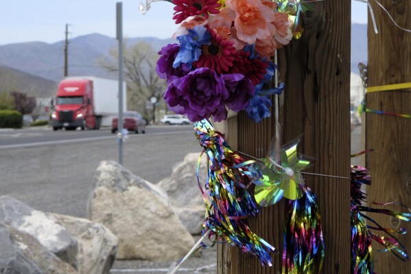 FILE -Mementos are placed at a makeshift memorial along the main street in Fernley, Nev., on Friday, April 8, 2022, in remembrance of 18-year-old Naomi Irion, who authorities say was kidnapped last month and killed. Troy Driver who was awaiting trial on kidnapping, sexual assault and murder charges in the March 2022 killing of Irion was found dead in his jail cell where he apparently killed himself, the local sheriff said. Driver was unresponsive when a deputy official found him in his cell in Yerington Sunday, Aug. 6, 2023, at about 6:17 p.m. and summoned others to help try to revive him, Lyon County Sheriff Brad Pope said in a statement. (AP Photo/Scott Sonner, File)