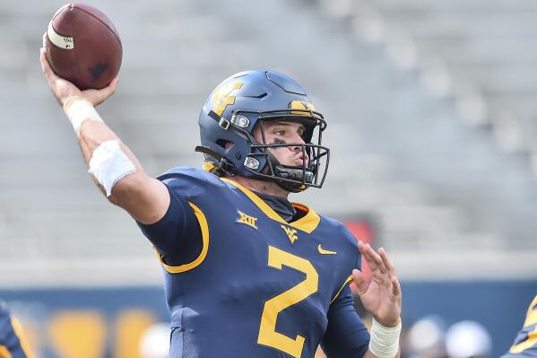 FILE - West Virginia quarterback Jarret Doege (2) makes a pass against Baylor during an NCAA college football game in Morgantown, W.Va., in this Saturday, Oct. 3, 2020, file photo. Doege enters his second full season as the starter as West Virginia opens the season Saturday, Sept. 4, 2021, at Maryland. (William Wotring/The Dominion-Post via AP, File)