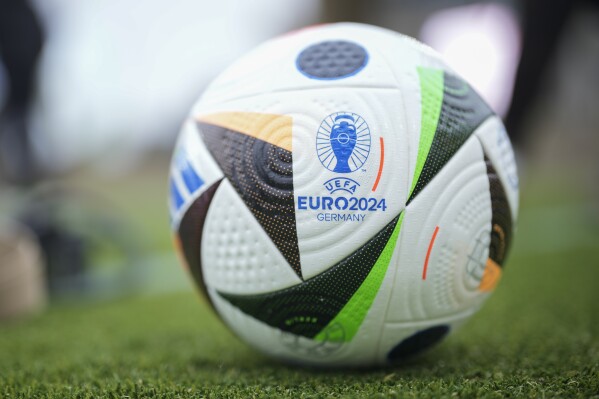A UEFA Euro 2024 Ball lays on the ground during a presentation of the new ball in Berlin, Germany, Wednesday, Nov. 15, 2023. The ball is named 'Fussballliebe' - 'Footbal Love' or 'Soccer Love'. (AP Photo/Markus Schreiber)