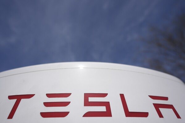 A Tesla level 3 charging station is seen on March 19, 2025, in Woodstock, Ga. (AP Photo/Mike Stewart, File)