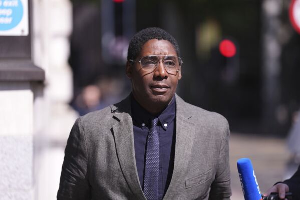 Art dealer Oghenochuko Ojiri walks outside Westminster Magistrates' Court, London, on Friday May 9, 2025. (Ben Whitley/PA via AP)