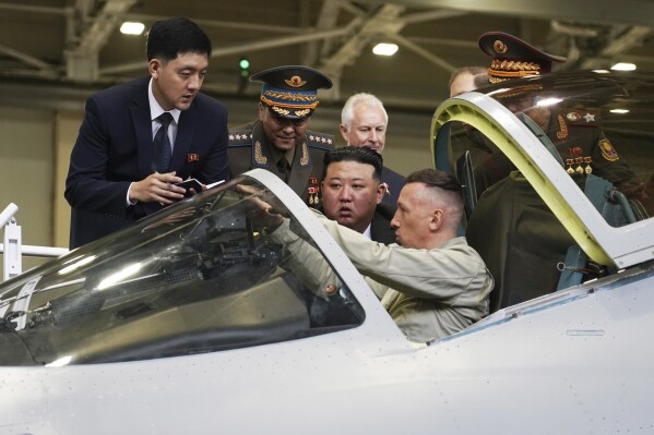 Kim Jong Un gets a close look at Russian fighter jets | AP News