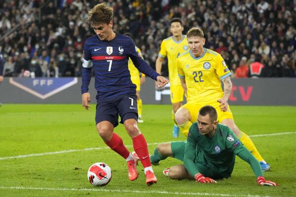 France's Antoine Griezmann, left, controls the ball during the World Cup 2022 group D qualifying soccer match between France and Kazakhstan at the Parc des Princes stadium in Paris, France, Saturday, Nov. 13, 2021. (AP Photo/Michel Euler)