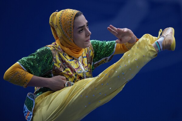 Iran's Hanieh Rajabi competes in the Wushu Women's Nanquan competition for the 19th Asian Games in Hangzhou, China, Tuesday, Sept. 26, 2023. (AP Photo/Ng Han Guan)