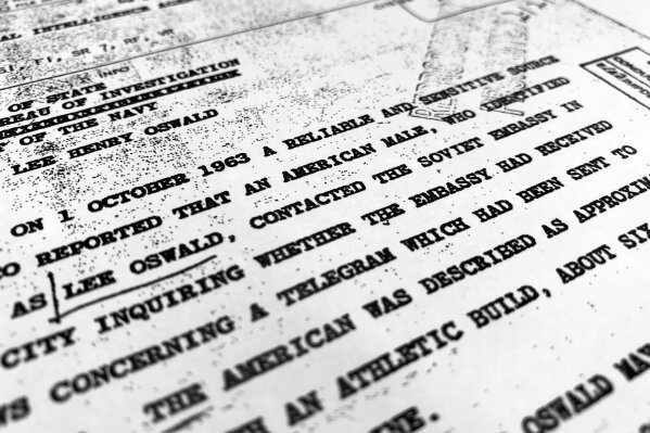 
              Part of a file from the CIA, dated Oct. 10, 1963, details "a reliable and sensitive source in Mexico" report of Lee Harvey Oswald's contact with the Soviet Union embassy in Mexico City, that was released for the first time on Friday, Nov. 3, 2017, by the National Archives. Documents show U.S. officials scrambling after the assassination of President John F. Kennedy to round up information about Lee Harvey Oswald's trip to Mexico City weeks earlier. (AP Photo/Jon Elswick)
            