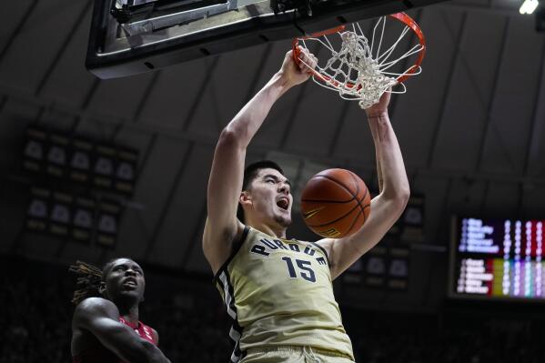 FILE - Purdue center Zach Edey (15) gets a dunk in front of Rutgers center Clifford Omoruyi during the second half of an NCAA college basketball game in West Lafayette, Ind., Monday, Jan. 2, 2023. UConn guard Tristen Newton announced Wednesday, May 31, 2023, that he is withdrawing his name from the NBA draft and will return to school as the Huskies attempt to repeat as national champions. A number of other college players have similar decisions to make and have not made their intentions known. Those include Zach Edey of Purdue, Kentucky's Oscar Tshiebwe, Missouri's Kobe Brown, UCLA's Adem Bona, Judah Mintz of Syracuse, Jordan Walsh of Arkansas and Terrence Shannon Jr. of Illinois.(AP Photo/Michael Conroy, File)