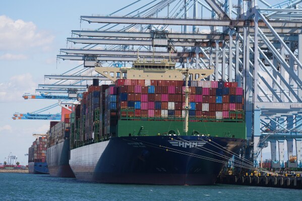 Ships are loaded at the Port of Los Angeles Wednesday, April 2, 2025, in Los Angeles. (AP Photo/Damian Dovarganes)