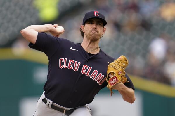 Cleveland Guardians pitcher Shane Bieber throws against the Detroit Tigers in the first inning of a baseball game in Detroit, Tuesday, Aug. 9, 2022. (AP Photo/Paul Sancya)