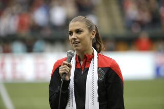 FILE - Portland Thorns forward Alex Morgan speaks to the crowd before their NWSL soccer match against the Seattle Reign in Portland, Ore., July 22, 2015. Morgan is returning to her home state, joining the San Diego Wave of the National Women’s Soccer League for the team's first season. The move to Southern California reunites Morgan with Wave President Jill Ellis, who coached Morgan to a pair of back-to-back World Cup titles. Morgan has been with the NWSL since its inception, playing for the Portland Thorns and Orlando Pride before joining San Diego. (AP Photo/Don Ryan, file)