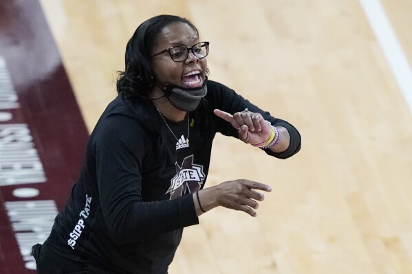 FILE - Mississippi State coach Nikki McCray-Penson lowers her mask as she calls to players during the second half of an NCAA college basketball game against South Carolina, Jan. 28, 2021, in Starkville, Miss. South Carolina women's basketball will host Rutgers in an exhibition game on Oct. 22, 2023, to honor the late player and coach McCray-Penson, who served as an assistant on both staffs. Both school announced the game Wednesday, Sept. 27. (AP Photo/Rogelio V. Solis, File)