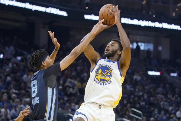 San Francisco 49ers NFL football player Deebo Samuel, center left, looks on  during the first half of an NBA basketball game between the Golden State  Warriors and the Memphis Grizzlies next to