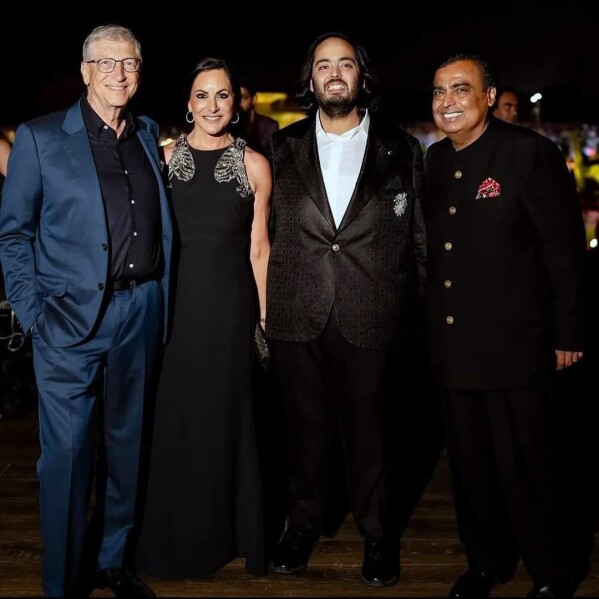 This photograph released by the Reliance group shows R to L, billionaire industrialist Mukesh Ambani, Anant Ambani, Paula Hurd, and Bill Gates posing for a photograph at a pre-wedding bash of Mukesh Ambani's son Anant in Jamnagar, India, Saturday, Mar. 02, 2024. (Reliance group via AP)