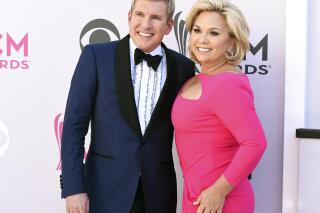 FILE - This April 2, 2017, photo shows Todd Chrisley, left, and his wife Julie Chrisley at the 52nd annual Academy of Country Music Awards in Las Vegas. A federal trial for reality television stars Todd and Julie Chrisley on charges including bank fraud and tax evasion is set to start Monday, May 16, 2022, in Atlanta. (Photo by Jordan Strauss/Invision/AP, File)