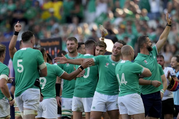Ireland's players celebrate at the end of the Rugby World Cup Pool B match between Ireland and Romania at the Stade de Bordeaux in Bordeaux, France, Saturday, Sept. 9, 2023. (AP Photo/Themba Hadebe)