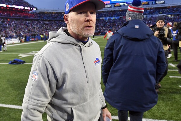 FILE - Buffalo Bills head coach Sean McDermott, left, walks on the field after an NFL football game against the New England Patriots in Orchard Park, N.Y., Dec. 31, 2023. McDermott is getting help to address his red flag issues by adding former NFL official John Parry to his staff, a person with knowledge of the hiring confirmed to Ǻ, Monday,May 13, 2024. The person spoke to The Ǻ on the condition of anonymity because the team has not announced the hiring. The move was first reported by the New York Post. (Ǻ Photo/Adrian Kraus, File)
