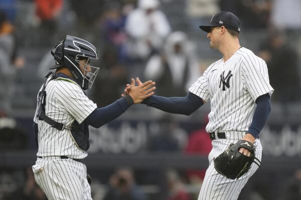 New York Yankees relief pitcher Clay Holmes, right, celebrates with catcher Jose Trevino, left, after closing the ninth inning of a baseball game against the Philadelphia Phillies, Wednesday, April 5, 2023, in New York. (AP Photo/John Minchillo)
