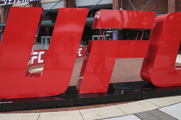 A UFC logo stands outside the arena, April 24, 2021, in Jacksonville, Fla. (AP Photo/Gary McCullough, file)
