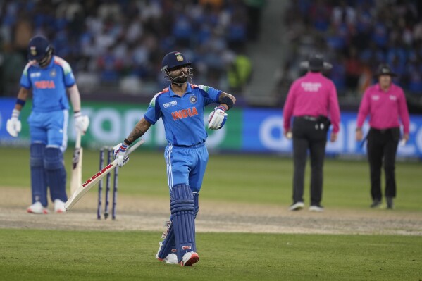 India's Virat Kohli walks off the field after losing his wicket during the ICC Champions Trophy semifinal cricket match between India and Australia at Dubai International Cricket Stadium in Dubai, United Arab Emirates, Tuesday, March 4, 2025. (AP Photo/Altaf Qadri)