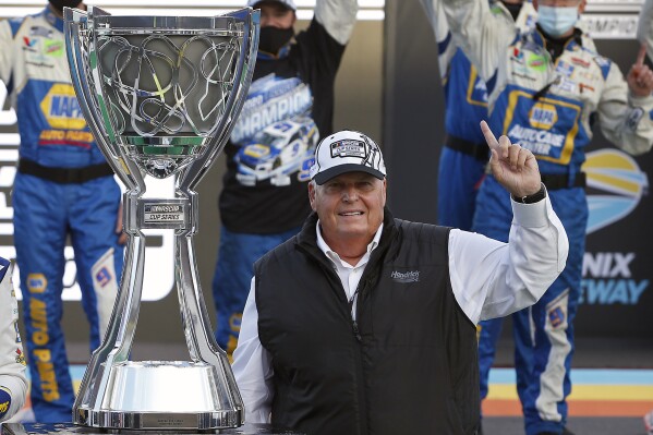FILE - Rick Hendrick celebrates in Victory Lane following the season championship victory by Chase Elliott in the NASCAR Cup Series auto race at Phoenix Raceway in Avondale, Ariz., Sunday, Nov. 8, 2020. Rick Hendrick and Hendrick Motorsports are marking the 40th anniversary of NASCAR’s winningest team.(AP Photo/Ralph Freso, File)