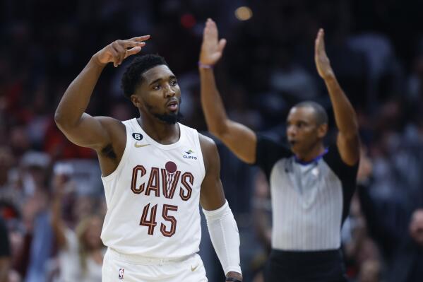 Cleveland Cavaliers guard Donovan Mitchell celebrates after hitting a three point basket against the Washington Wizards during the second half of an NBA basketball game, Sunday, Oct. 23, 2022, in Cleveland. The Cavaliers won 117-107 in overtime. (AP Photo/Ron Schwane)