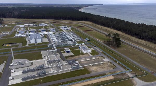 FILE - The landfall facilities of the 'Nord Stream 2' gas pipeline are pictured in Lubmin, northern Germany, Feb. 15, 2022. Nord Stream 2 is a 1,230-kilometer-long (764-mile-long) natural gas pipeline under the Baltic Sea, running from Russia to Germany's Baltic coast. It’s harder to find alternative sources of natural gas because it comes mainly by pipeline. It would be easier to find other sources for oil, which mostly moves by tanker and is traded globally. So a natural gas boycott is off the table for now. Heavy gas users like Germany say an immediate cutoff could cost jobs, with industrial associations warning of shutdowns in glass and metals businesses. (AP Photo/Michael Sohn)