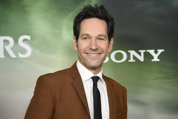 FILE - Paul Rudd attends the premiere of "Ghostbusters: Afterlife" at AMC Lincoln Square 13 Nov. 15, 2021, in New York. People’s Sexiest Man Alive of 2021 is set to be inducted into the vaunted Five-Timers Club on “Saturday Night Live,” but the surging omicron variant of the coronavirus means there won’t be a live audience to see it happen. The show announced on social media Saturday, Dec. 18, that the night’s episode would tape without a live audience and with only limited cast and crew. “Ant-Man” star Rudd is the host and British pop star Charli XCX is the night’s musical guest. (Photo by Evan Agostini/Invision/AP, File)