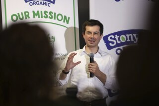 In this April 19, 2019, photo, Democratic presidential candidate South Bend Mayor Pete Buttigieg answers questions from employees during a campaign stop at a dairy company in Londonderry, N.H.
Buttigieg’s presidential campaign has attention and money. Now he has to convert that into a sustainable operation that can keep him in the race well into next year. (AP Photo/Charles Krupa)