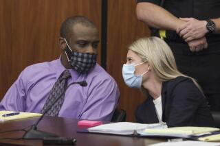 Defendant Nathaniel Rowland speaks with his attorney, Alicia Goode, right, during his trial in Richland County Court, Tuesday, July 20, 2021, in Columbia, S.C. Rowland is on trial for the kidnapping and murder of 21-year-old Samantha Josephson. (Tracy Glantz/The State via AP)