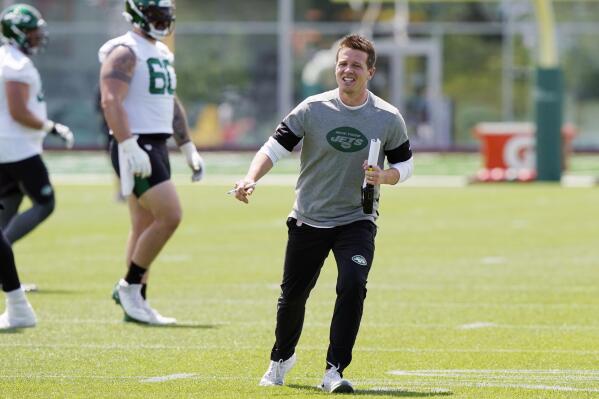 FILE - In this May 27, 2021, file photo, New York Jets offensive coordinator Mike LaFleur directs his players during an NFL football practice in Florham Park, N.J. LaFleur was still a teenager living at home when his big brother would bring his buddy over so they could raid the family's refrigerator and intercept the TV remote.  (AP Photo/Kathy Willens, File)